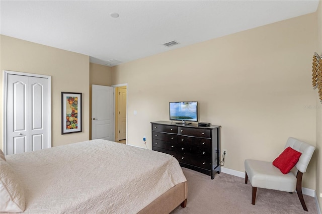 carpeted bedroom with a closet