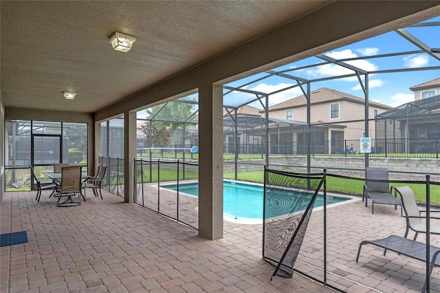 view of pool featuring a lanai and a patio area