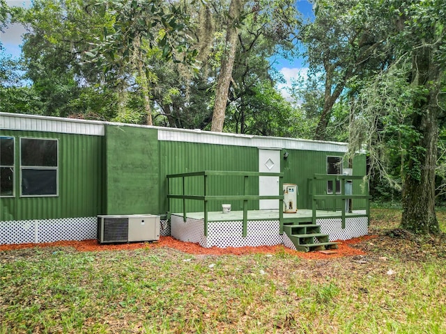 view of home's exterior with central AC unit