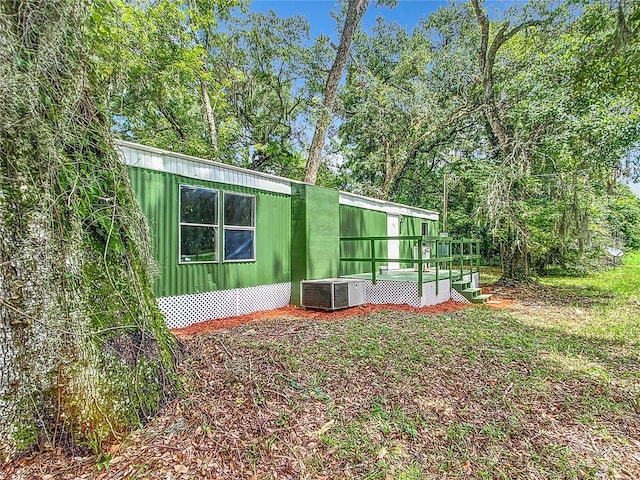 view of home's exterior with central AC unit