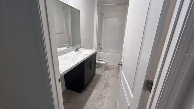 full bathroom with tile patterned flooring, toilet,  shower combination, and vanity