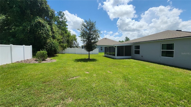 view of yard with a sunroom