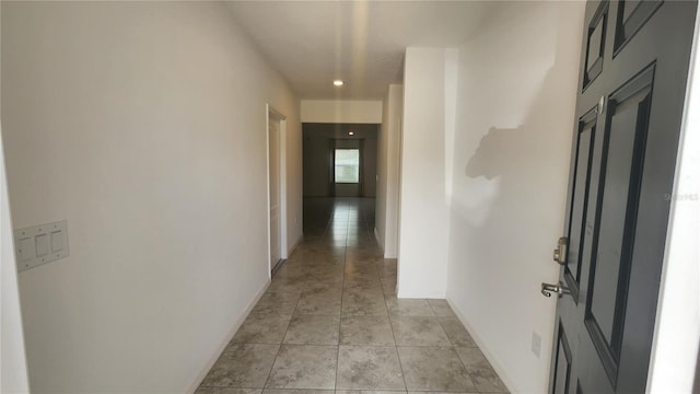 hallway with light tile patterned flooring