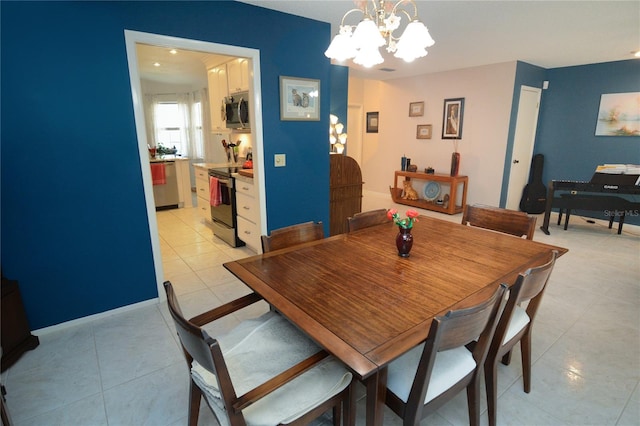 tiled dining area with an inviting chandelier