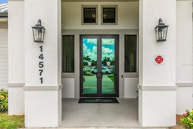 view of exterior entry featuring french doors