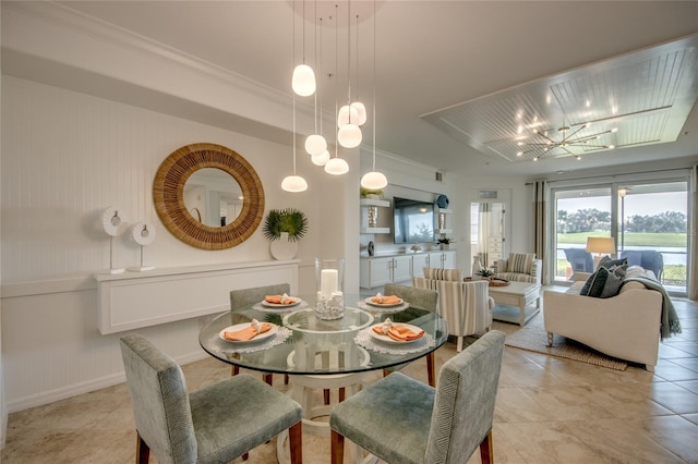 tiled dining room featuring crown molding and a notable chandelier