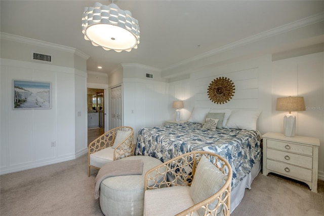 bedroom featuring light colored carpet, ornamental molding, and a closet