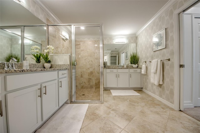 bathroom featuring vanity, an enclosed shower, and ornamental molding