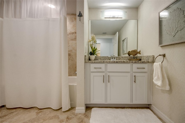 bathroom with vanity and shower / tub combo