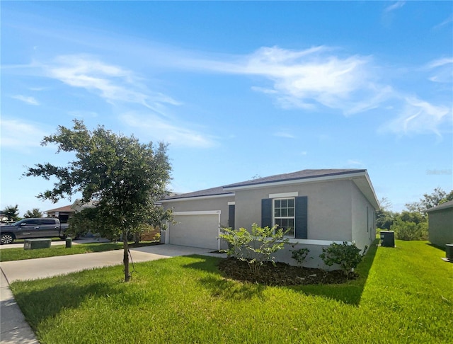 single story home with a front yard and a garage