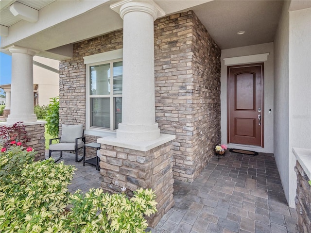 doorway to property featuring covered porch