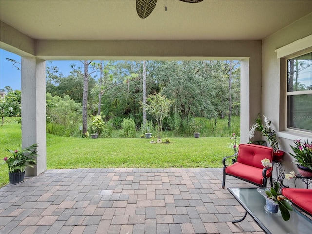 view of patio featuring ceiling fan