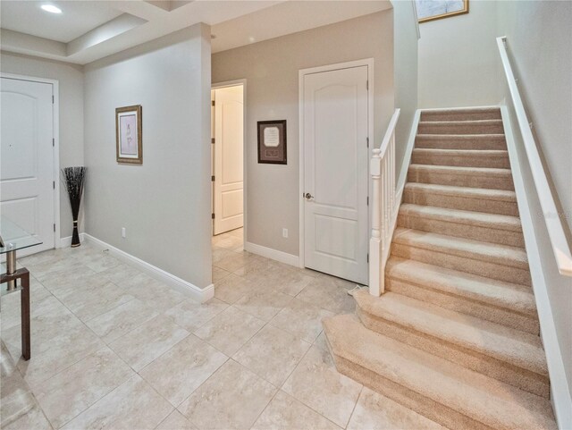 foyer featuring light tile patterned floors