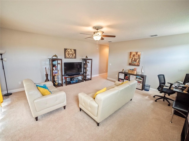 living room featuring ceiling fan and light colored carpet