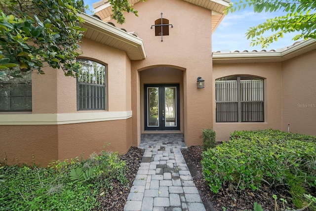 property entrance featuring french doors