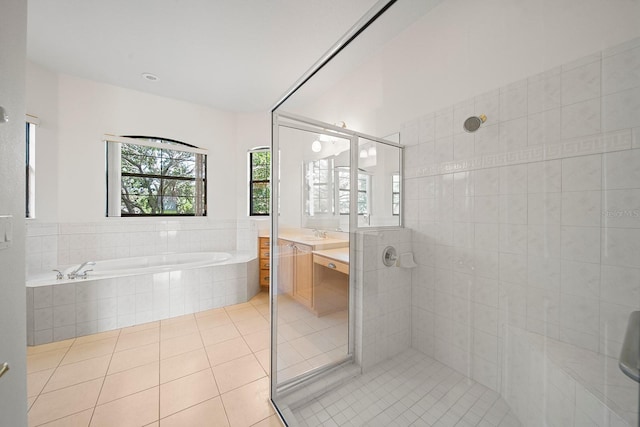 bathroom featuring separate shower and tub, tile patterned flooring, and vanity