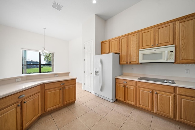 kitchen featuring white appliances, an inviting chandelier, light tile patterned flooring, and pendant lighting