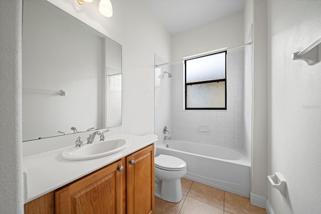 full bathroom featuring toilet, tiled shower / bath, tile patterned floors, and vanity