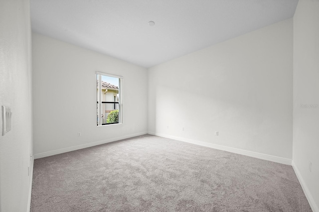 unfurnished room with carpet flooring