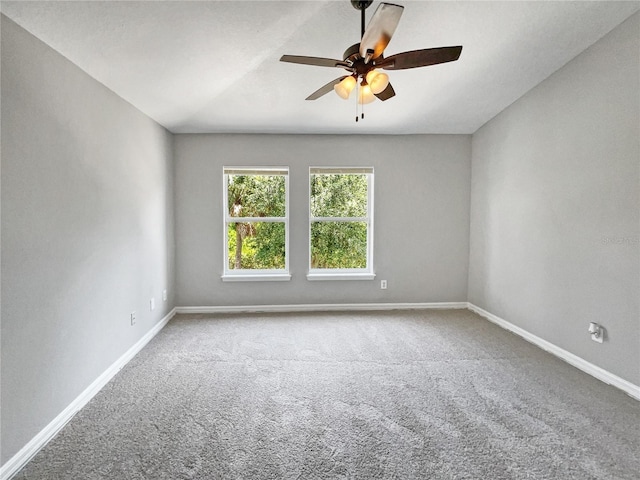 empty room featuring carpet floors and ceiling fan