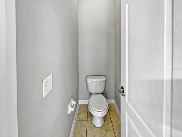 bathroom featuring tile patterned floors and toilet