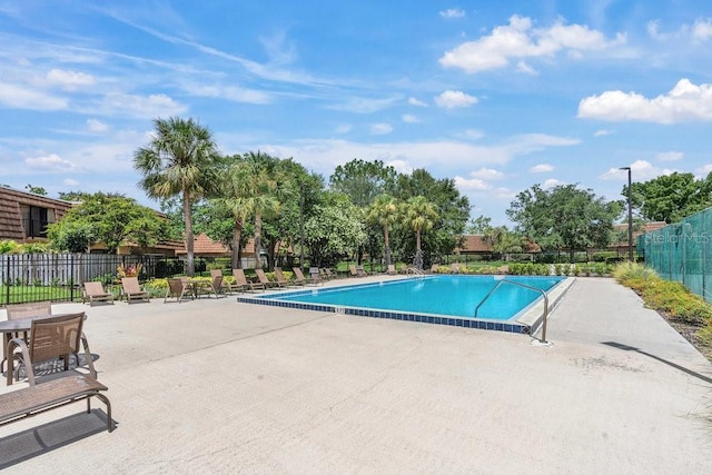 view of swimming pool featuring a patio area