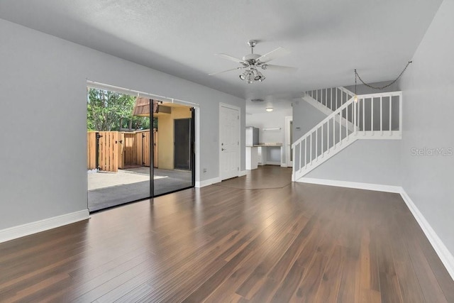 empty room with dark wood-type flooring and ceiling fan