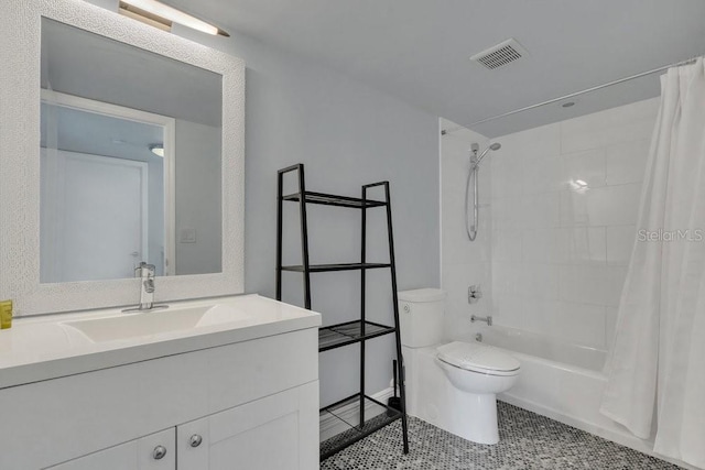 full bathroom featuring vanity, toilet, tile patterned flooring, and shower / bath combo with shower curtain