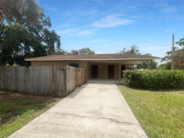 view of front of property with a carport