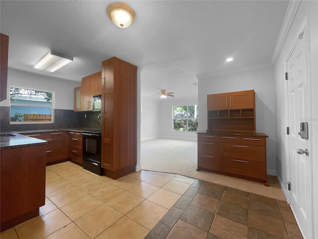 kitchen with tasteful backsplash, black electric range oven, light colored carpet, ornamental molding, and ceiling fan