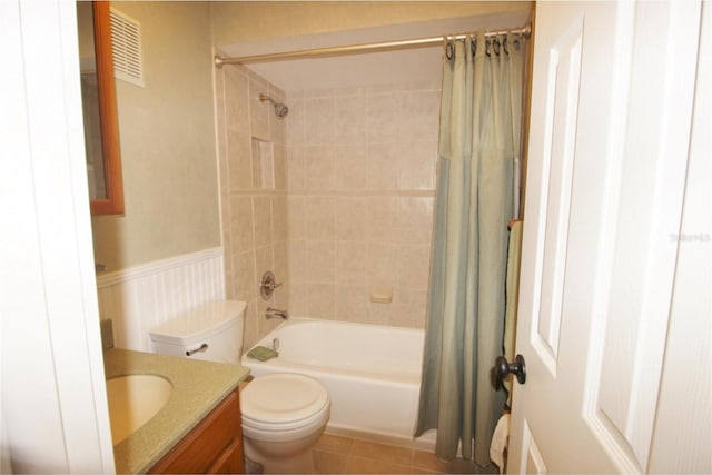 full bathroom featuring tile patterned floors, vanity, toilet, and shower / bathtub combination with curtain