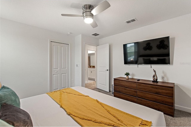 carpeted bedroom with a closet and ceiling fan