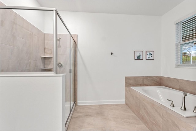 bathroom featuring independent shower and bath and tile patterned flooring