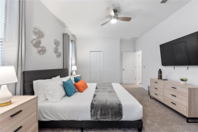 carpeted bedroom with a closet and ceiling fan