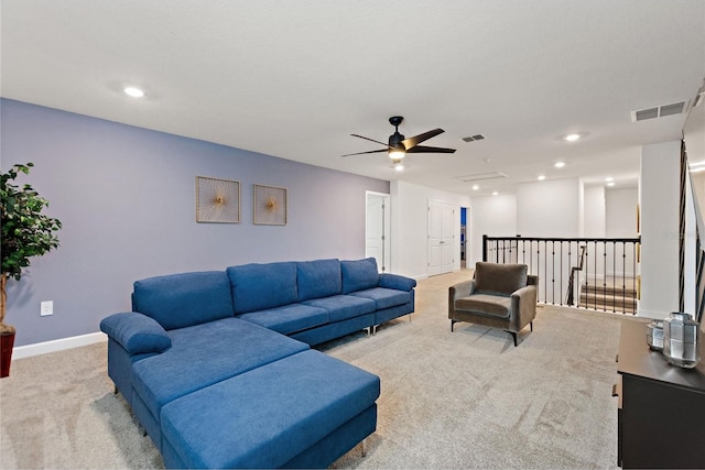 living room with carpet and ceiling fan