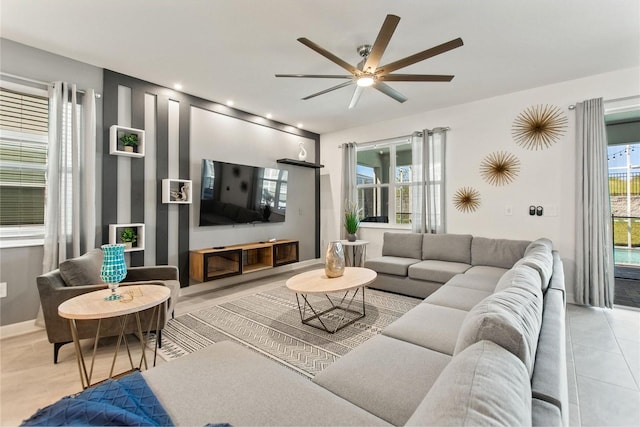 tiled living room featuring ceiling fan