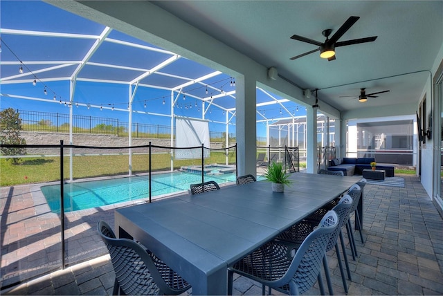 view of swimming pool with an outdoor hangout area, a patio, ceiling fan, and a lanai