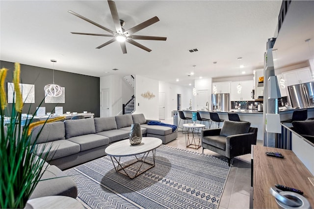 living room with ceiling fan