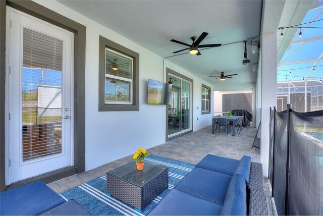 view of patio / terrace with an outdoor hangout area and ceiling fan