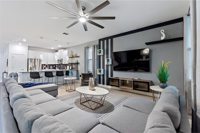 living room featuring ceiling fan