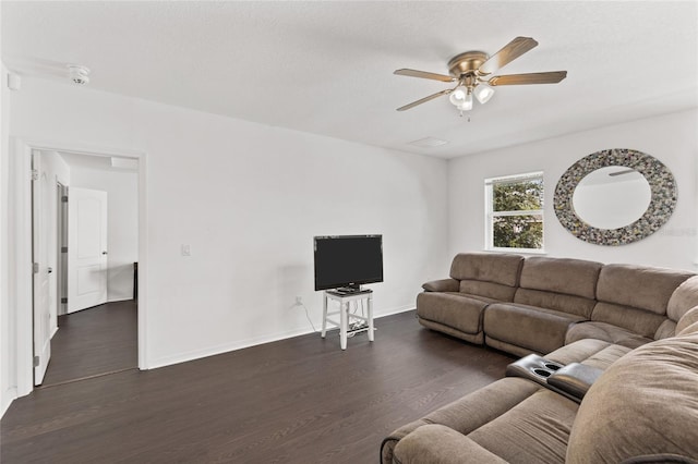 living room with dark hardwood / wood-style floors and ceiling fan