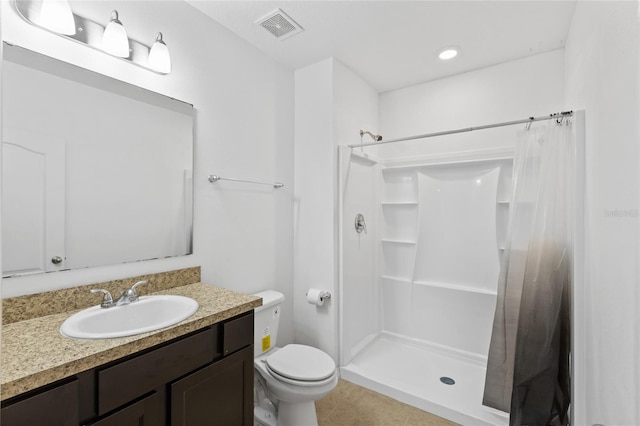 bathroom featuring vanity, tile patterned floors, toilet, and a shower with shower curtain