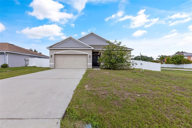 view of front facade with a garage and a front yard