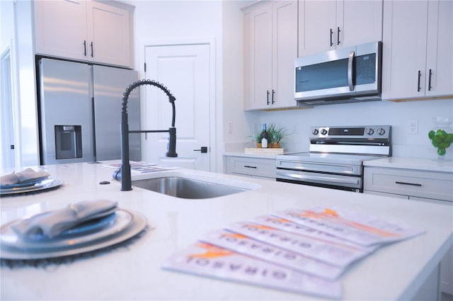 kitchen featuring stainless steel appliances and sink