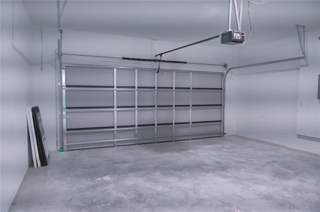 garage featuring a garage door opener and electric panel