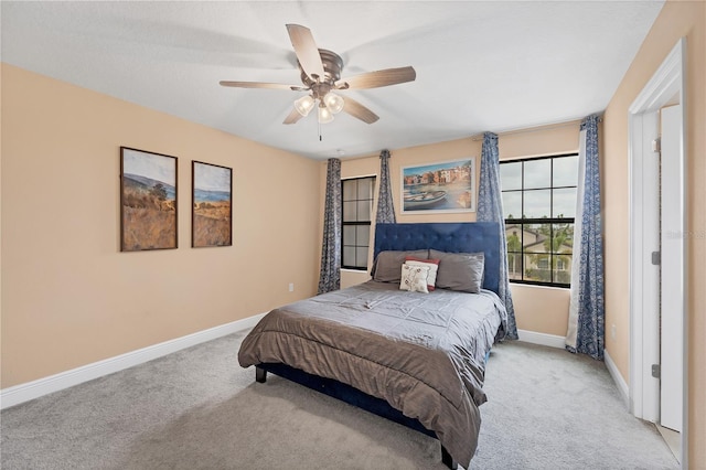 bedroom featuring baseboards, carpet, and ceiling fan