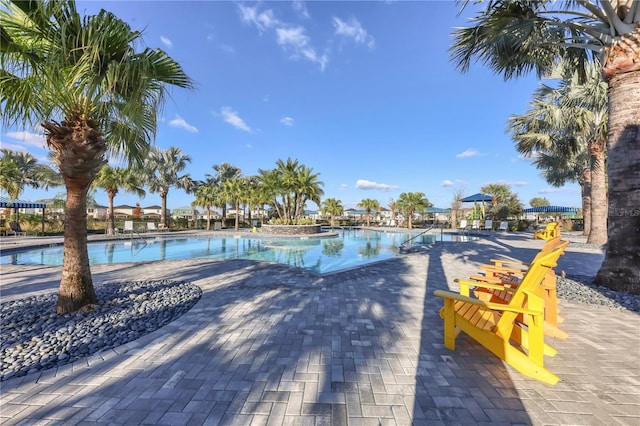 community pool featuring a patio area