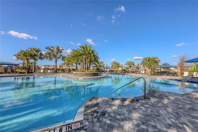 community pool featuring a patio area