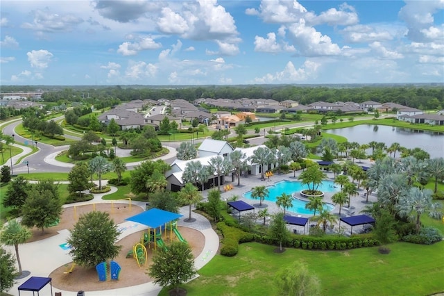 drone / aerial view with a residential view and a water view