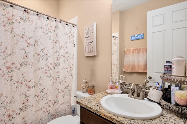 full bath with a shower with curtain, toilet, and vanity